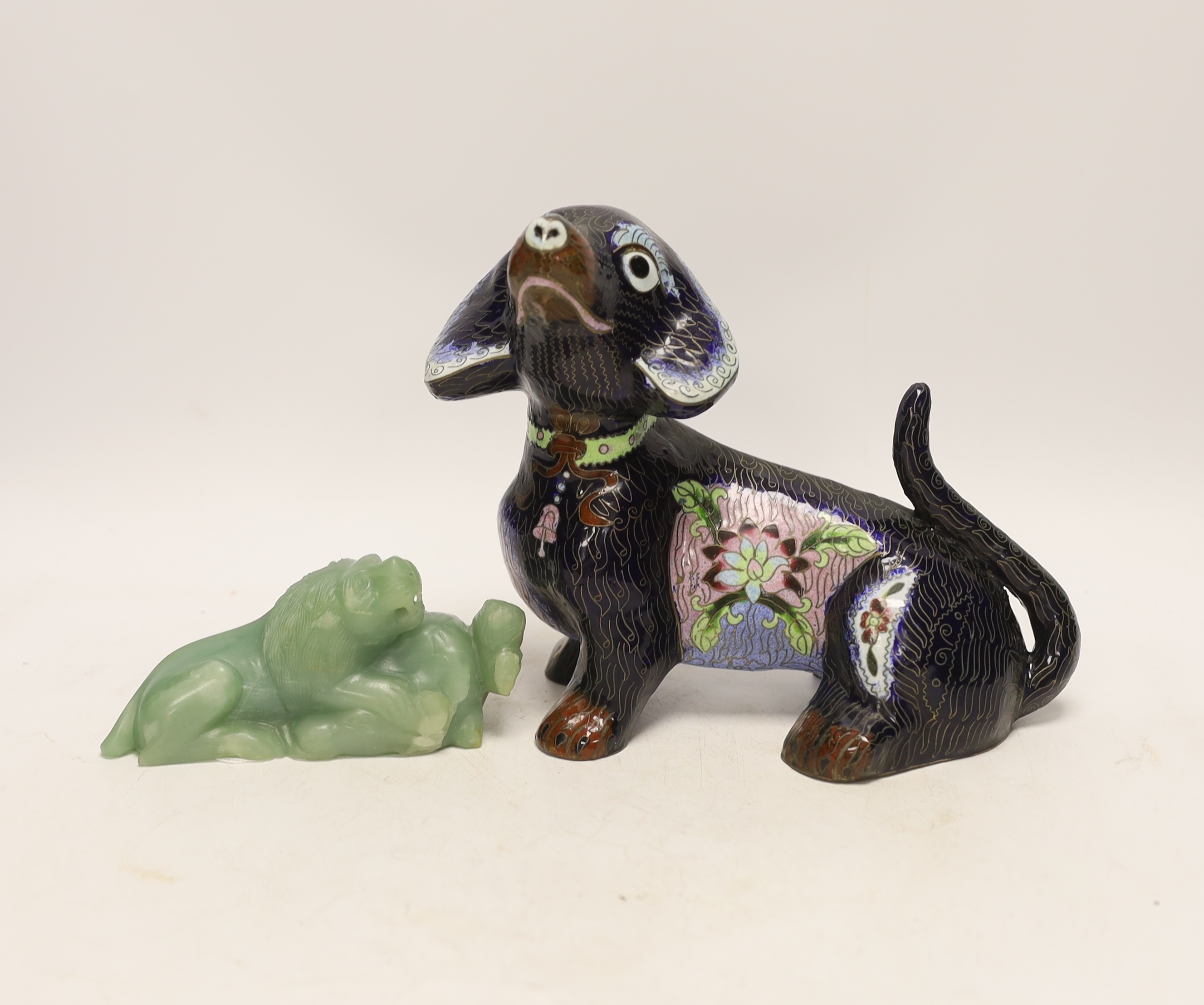 A Chinese bowenite jade figure of a lion, 6cm high, and a Chinese cloisonné enamel seated figure of a hound, 18cm high